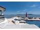In-ground pool, spa, plenty of deck space, and stunning lake view at 3386 Governors Island Dr, Denver, NC 28037