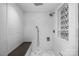 Modern shower with white subway tile, a rainfall showerhead, handheld sprayer, and a built-in bench at 3386 Governors Island Dr, Denver, NC 28037