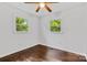 Bedroom featuring gleaming hardwood floors, bright windows, and ample natural light at 370 Old Camden Rd, Lancaster, SC 29720
