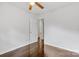 A cozy bedroom featuring hardwood floors, neutral walls, and natural light from a doorway at 370 Old Camden Rd, Lancaster, SC 29720