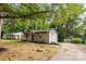 Charming single-story home with light brick, dark trim, a well-manicured lawn and landscape beds at 370 Old Camden Rd, Lancaster, SC 29720