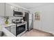 Updated kitchen with stainless steel appliances, modern cabinetry, and tile backsplash at 370 Old Camden Rd, Lancaster, SC 29720