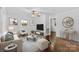 Bright living room with hardwood floors, neutral decor, and ample natural light at 370 Old Camden Rd, Lancaster, SC 29720