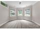 Well-lit bedroom with multiple windows providing ample natural light at 3815 Stoney Ridge Trl, Charlotte, NC 28210