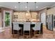 Kitchen featuring a central island with seating and modern lighting at 3815 Stoney Ridge Trl, Charlotte, NC 28210