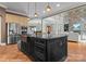 Spacious kitchen features a large island, stainless steel appliances, and an open design concept at 3815 Stoney Ridge Trl, Charlotte, NC 28210