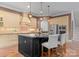 Open kitchen with an island, pendant lighting, stainless steel appliances, and breakfast bar at 3815 Stoney Ridge Trl, Charlotte, NC 28210