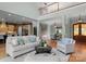 Open-concept living room with hardwood floors, fireplace, and staircase at 3815 Stoney Ridge Trl, Charlotte, NC 28210