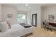 Bright bedroom with hardwood floors, a large window, and a desk area at 405 Gladelynn Way, Waxhaw, NC 28173