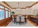 Formal dining room with wood trim, hardwood floors, and a decorative chandelier at 405 Gladelynn Way, Waxhaw, NC 28173