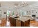 Spacious kitchen with an island, seamlessly connected to the dining and living areas, perfect for entertaining and Gathering time at 405 Gladelynn Way, Waxhaw, NC 28173
