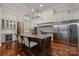 Well-appointed kitchen with a large island, stainless steel appliances, and custom cabinets at 405 Gladelynn Way, Waxhaw, NC 28173