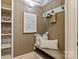 Charming mudroom with built-in shelves, a cozy bench, and decorative accents offers a welcoming and organized entry at 405 Gladelynn Way, Waxhaw, NC 28173