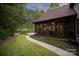 View of a screened-in porch and a walkway leading to the pool and patio area at 405 Gladelynn Way, Waxhaw, NC 28173