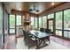 Inviting sunroom complete with an outdoor kitchen, stainless steel appliances, and a dining set provides a luxurious retreat at 405 Gladelynn Way, Waxhaw, NC 28173
