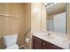 Bathroom featuring a large mirror over vanity, toilet, and towel rack at 4100 B Christine Ln, Waxhaw, NC 28173