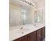 Bathroom featuring dual sinks, ample countertop space, and a large mirror, providing functionality and style at 4100 B Christine Ln, Waxhaw, NC 28173
