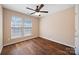 Bedroom with natural light from two windows and hardwood floors, providing a cozy and functional space at 4100 B Christine Ln, Waxhaw, NC 28173
