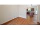 Cozy dining area featuring wood flooring and access to the kitchen at 4100 B Christine Ln, Waxhaw, NC 28173