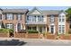 Charming townhome with brick facade, manicured landscaping, and inviting front porch at 4100 B Christine Ln, Waxhaw, NC 28173