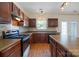 Well-lit kitchen featuring wood cabinets, modern appliances, ample counter space, and a central island for food preparation at 4100 B Christine Ln, Waxhaw, NC 28173