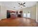 Well-lit kitchen with an island, dark cabinetry, and double doors to the backyard at 4100 B Christine Ln, Waxhaw, NC 28173