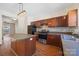 Traditional kitchen with wooden cabinets, stainless steel appliances, and an island, offering a functional and inviting space at 4100 B Christine Ln, Waxhaw, NC 28173