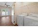 Bright laundry area with washer and dryer, providing convenience and functionality near the living area at 4100 B Christine Ln, Waxhaw, NC 28173