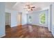 Spacious main bedroom with a tray ceiling, ceiling fan, and natural light, creating a relaxing and inviting atmosphere at 4100 B Christine Ln, Waxhaw, NC 28173