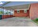 A convenient carport attached to a red brick home at 413 N Mulberry St, Cherryville, NC 28021