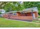 Beautiful brick home with a covered porch and manicured lawn, offering a welcoming curb appeal at 413 N Mulberry St, Cherryville, NC 28021