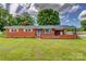 Charming brick home featuring a well-maintained lawn and covered porch, perfect for outdoor enjoyment at 413 N Mulberry St, Cherryville, NC 28021
