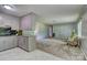 Kitchen flows to living area, featuring granite countertops, ample cabinet space, and modern appliances at 413 N Mulberry St, Cherryville, NC 28021
