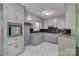 Well-lit kitchen featuring granite countertops, ample cabinet space, and modern appliances at 413 N Mulberry St, Cherryville, NC 28021