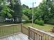 Spacious backyard view from the deck showing plenty of mature trees at 423 S Rhyne St, Dallas, NC 28034