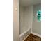 Bathroom showcases a tiled tub/shower combination with a small window at 423 S Rhyne St, Dallas, NC 28034