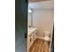 Bathroom boasts modern vanity with dual sinks, wood-look flooring, and sliding barn door at 423 S Rhyne St, Dallas, NC 28034
