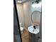 Updated bathroom featuring modern fixtures and a stylish round mirror at 423 S Rhyne St, Dallas, NC 28034