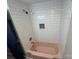 Bathroom with subway tile shower, and pink bathtub at 423 S Rhyne St, Dallas, NC 28034