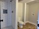 Bathroom with tiled shower, toilet, and laundry hook-ups at 423 S Rhyne St, Dallas, NC 28034
