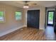 Spacious bedroom with stylish closet doors, wood-look flooring, and natural light at 423 S Rhyne St, Dallas, NC 28034