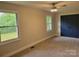 Carpeted bedroom with natural light from two windows, plus large closet at 423 S Rhyne St, Dallas, NC 28034