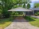 Carport with a concrete floor and a view of the fenced-in backyard at 423 S Rhyne St, Dallas, NC 28034