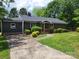 Charming home with a well-manicured lawn and inviting curb appeal at 423 S Rhyne St, Dallas, NC 28034