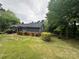 Side view of home on a sunny day at 423 S Rhyne St, Dallas, NC 28034