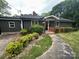 Charming home exterior featuring a covered front porch at 423 S Rhyne St, Dallas, NC 28034
