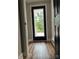 Hallway showcasing hardwood floors and a door leading to an outdoor deck at 423 S Rhyne St, Dallas, NC 28034