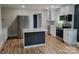 Beautiful kitchen with stainless steel appliances, island, and sleek cabinetry at 423 S Rhyne St, Dallas, NC 28034