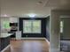 Bright kitchen featuring black accent wall and stainless steel appliances at 423 S Rhyne St, Dallas, NC 28034