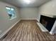 Bright living room with a decorative fireplace at 423 S Rhyne St, Dallas, NC 28034